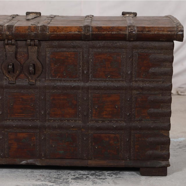 Antique Indian Teakwood and Iron Blanket Chest/Coffee Table, in a natural dark teakwood finish with decorative iron...