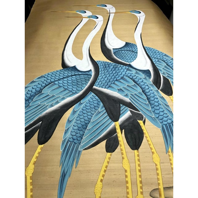 Striking hand‑painted wall panel featuring four elegant cranes against a warm gold‑toned background. Graceful bird motifs...