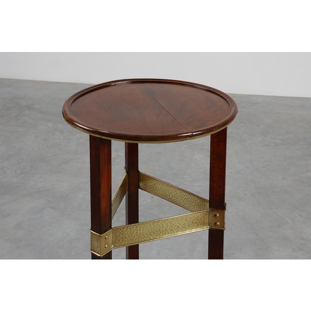 Belgium / 1910 / Piedestal / wood and brass / Art Nouveau An elegant Belgian pedestal table dating to circa 1910, crafted...