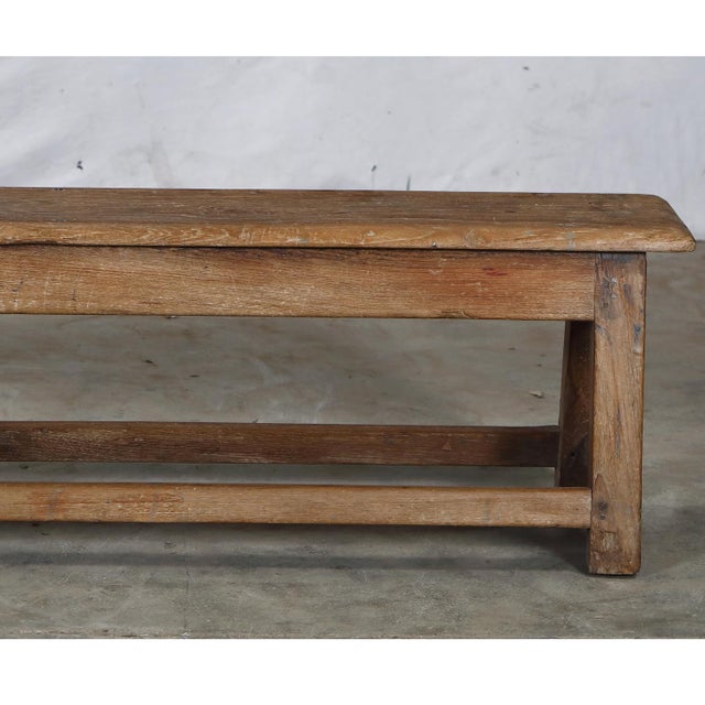 Vintage Indian Teakwood Bench, mid-century from a school or public space. It is functional and versatile with a beautiful...