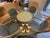 20th century Cast stone, rattan wrap column pedestal table. Glass top sits on base. Four rattan wrap arm chairs. In the...