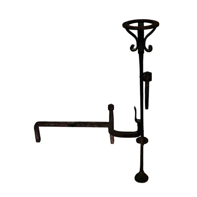 Pair of antique early 20th century Arts and Crafts style andirons. Black wrought iron with a rustic, artisan-crafted...