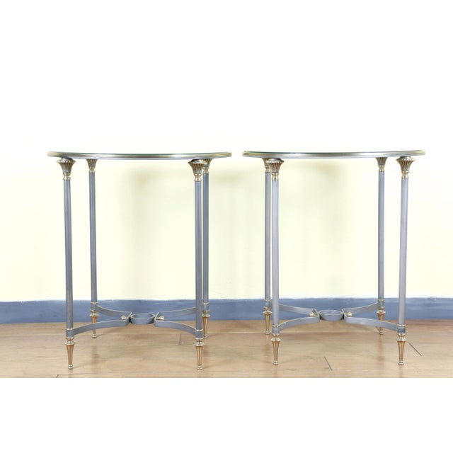 Beautiful pair of Italian side tables from the 1970s. Made of brass and metal with a glass top. They are in a very good...