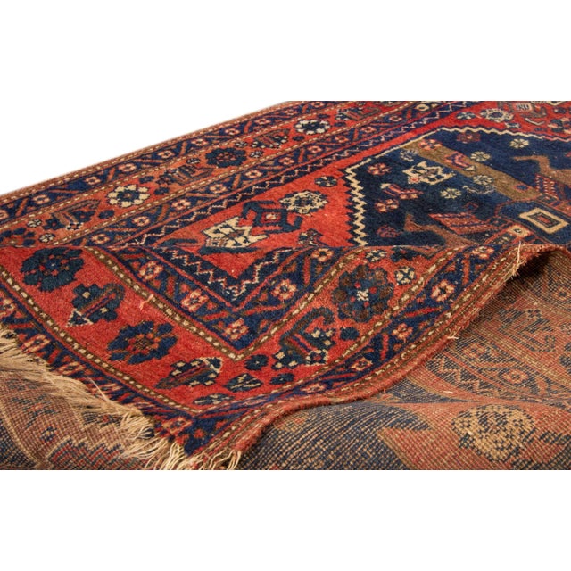 Beautiful vintage Persian hand-knotted wool rug with a red field. This piece has a multi-color accent in an all-over...