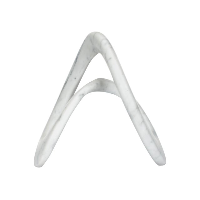 Carved from solid Carrera marble, Carewyn blends a classic material with a contemporary shape into an impactful sculptural...