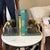 A stunning pair of vintage Hollywood Regency bookends featuring solid cast brass grazing horses mounted on thick verde...