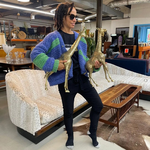 Pair of large scale solid brass giraffe sculptures. This stunning pair varies in size. The largest of the two stands at...