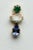 An elegant trio of gemstones comprise this pair of bezel-set stud earrings in 18K gold. The top stone is a round, faceted...