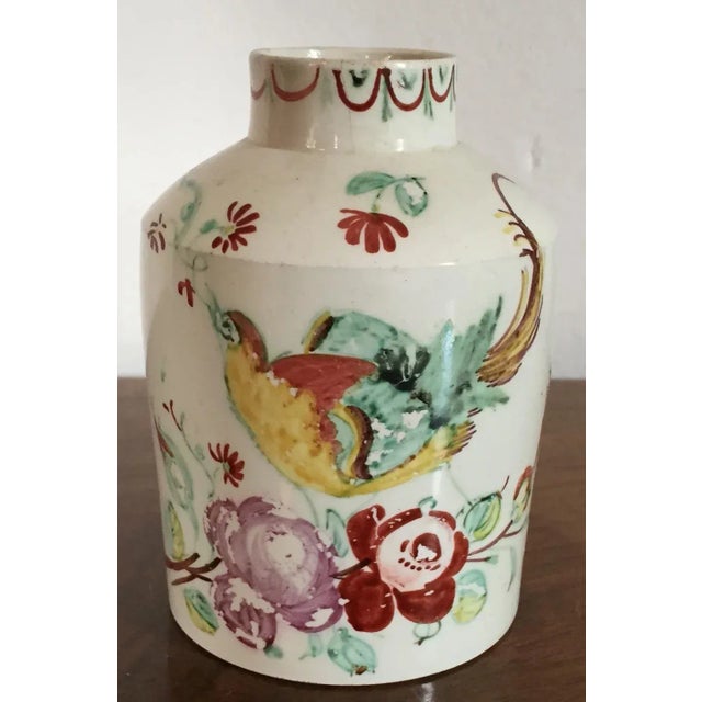 Antique 18th c. English Staffordshire creamware tea caddy decorated in the King's rose pattern with an exotic bird....