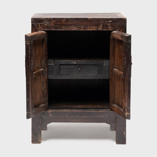 This small Chinese locking cabinet from the early 20th century has a richly aged patina that only time can achieve. The...