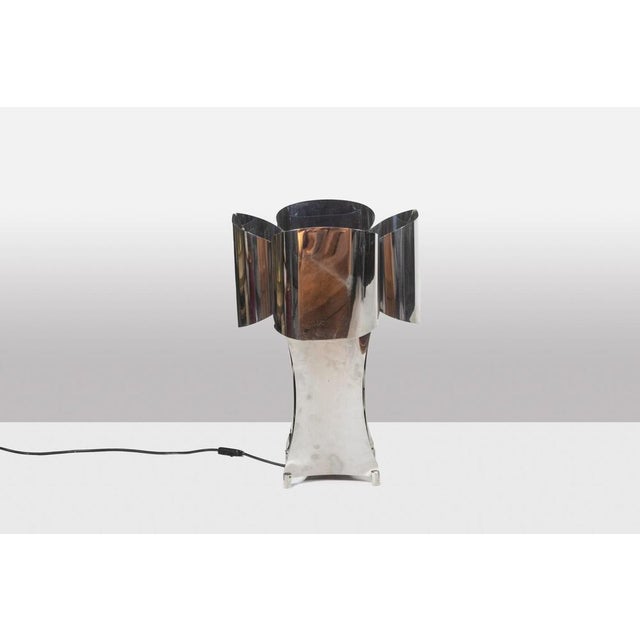 “Quadrilobe” lamp in polished metal. 4 globes of rounded shape, was of flared shape. French work realized in the 1970s....