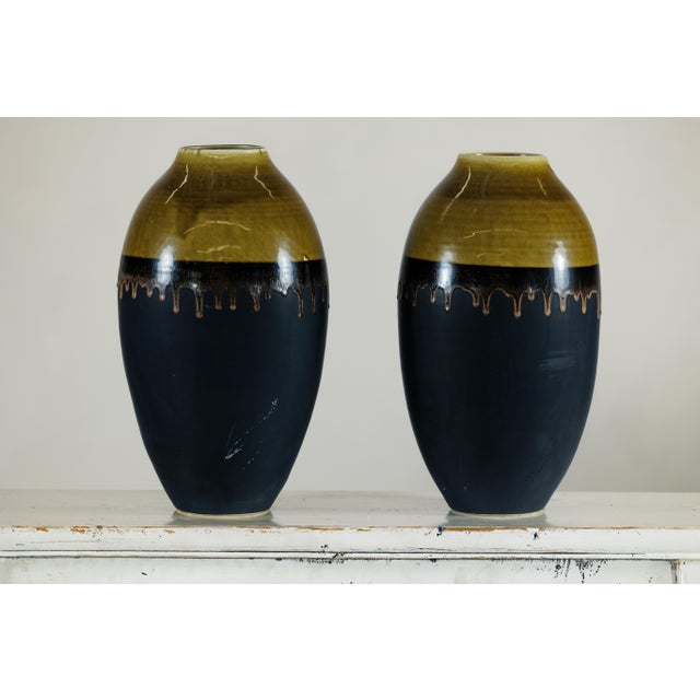 "About the Item This pair of large artisan ceramic vases combines sculptural presence with handcrafted detail. Each vase...