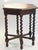 An amazing antique wooden side table with an hexagonal top. The side table is standing on 6 barely twist legs. Rare to...