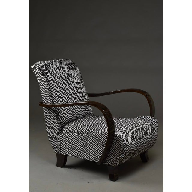An Art Deco armchair dating from the 1930s–1940s, most likely of Polish origin. This piece stands out through its...