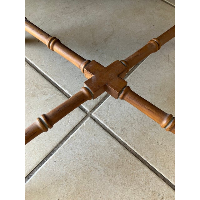 Vintage rattan and leather bench. I am not sure when this was made, but it looks vintage to me. It was made by the Ethan...