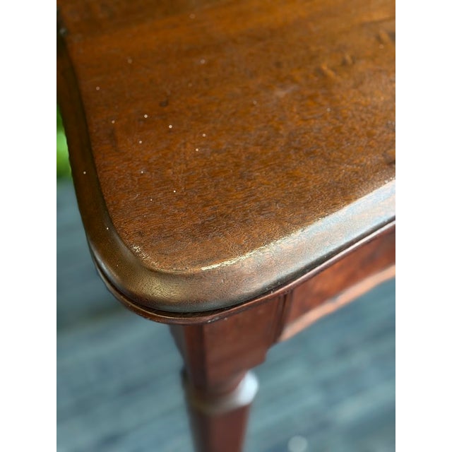 We believe this piece to be figured walnut, it's a traditional tea table measuring 32.25" x 34" when open (and 29" high)...