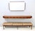 Made in Italy, 1959. The console table are made in walnut. The design of the corners of the mirror recalls that of the...