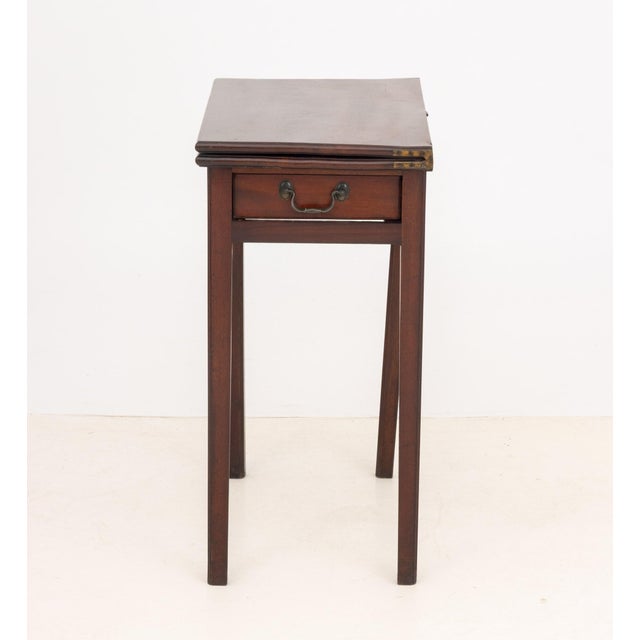 George III Mahogany Fold-Over Gate Leg Table, with single drawer. Open: 27" H x 28" W x 26" D; closed: 27.5" H x 14" W x...