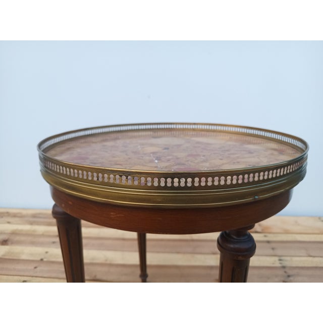 Mid-20th Century reproduction of a French Louis XVI style bouillotte table. These tables were originally designed in the...