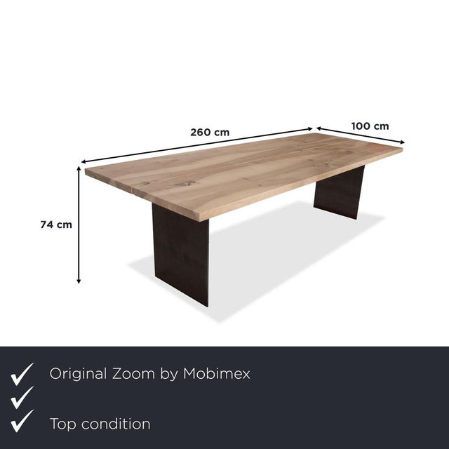 This dining table from the TIX collection, designed by Dante Bonuccelli for Zoom by Mobimex, is a monumental statement of...