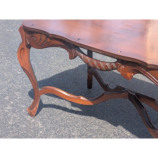 This exquisite Mid Century Modern carved wood tray table is a masterclass in versatile design and intricate craftsmanship,...