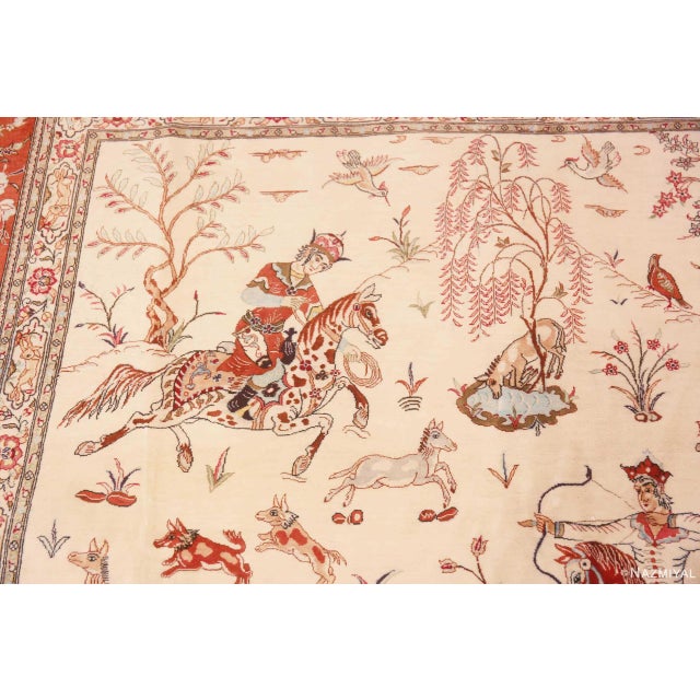 Artistic Fine Light Luxurious Silk Pile Vintage Artistic Hunting Scene Design Persian Qum Rug, country of origin: Persian...