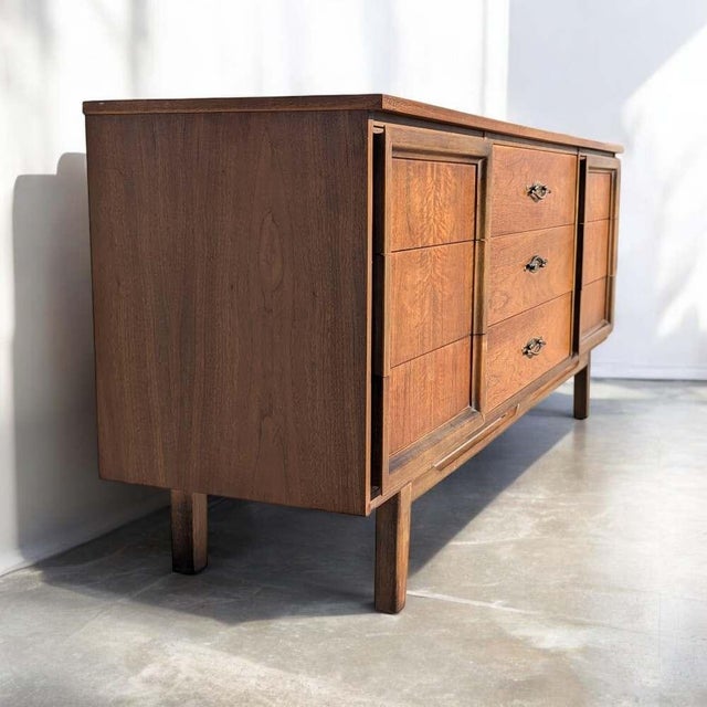 L.A. Period Furniture Nine-Drawer Walnut Dresser. A substantial vintage low dresser by L.A. Period Furniture with nine...