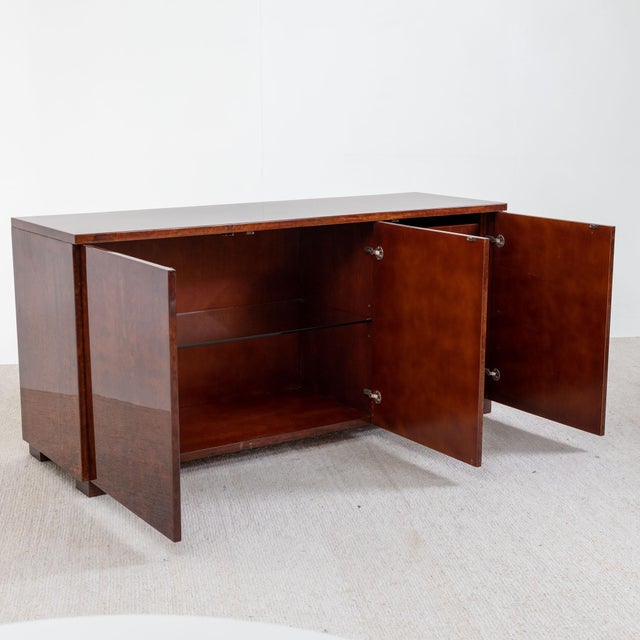 Three-door sideboard covered with dark brown lacquered goatskin. This sideboard was designed by Aldo Tura in the 1970s....