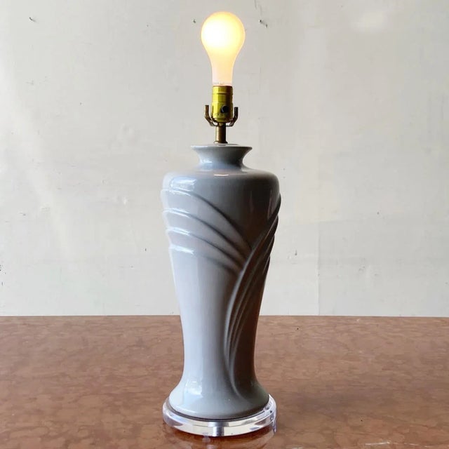Amazing postmodern ceramic table lamp. Features a lucite base and gray glossy finish. 3 way lighting