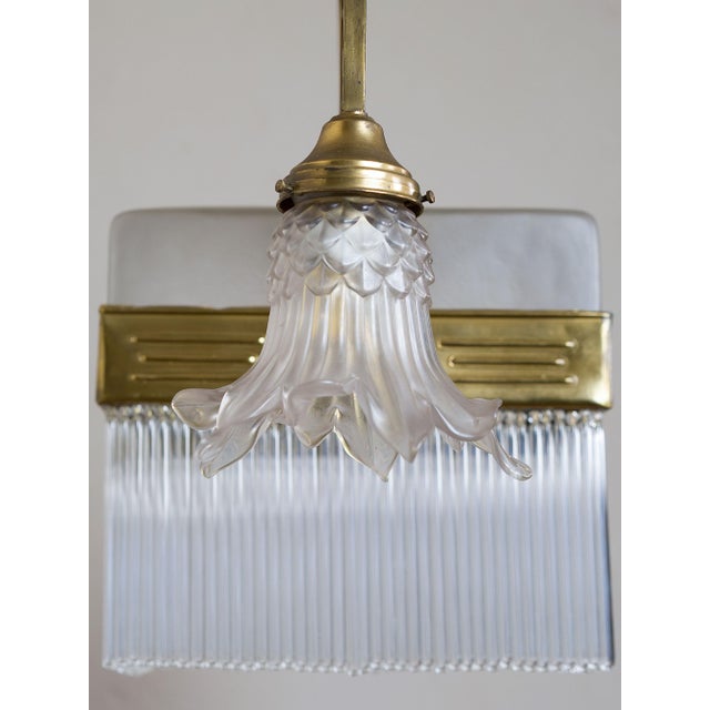 Art Nouveau (Liberty) chandelier from the early 1900s, crafted from brass with refined floral ornamental motifs, typical...