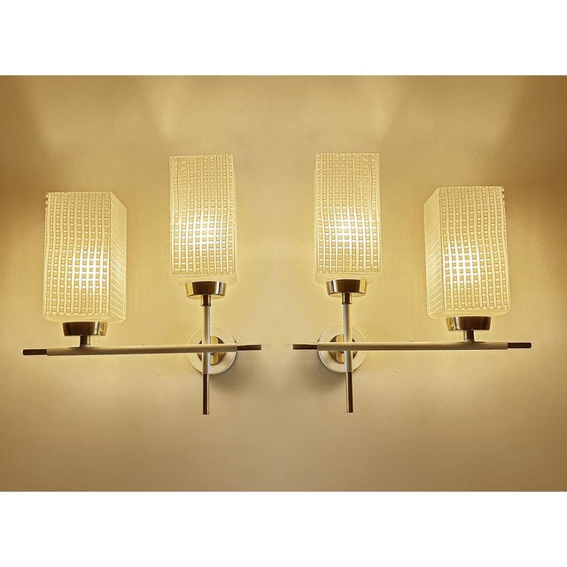 Pair of Vintage french sconces with square opaline glass shades with a contrasting checkered serigraphed pattern , mounted...