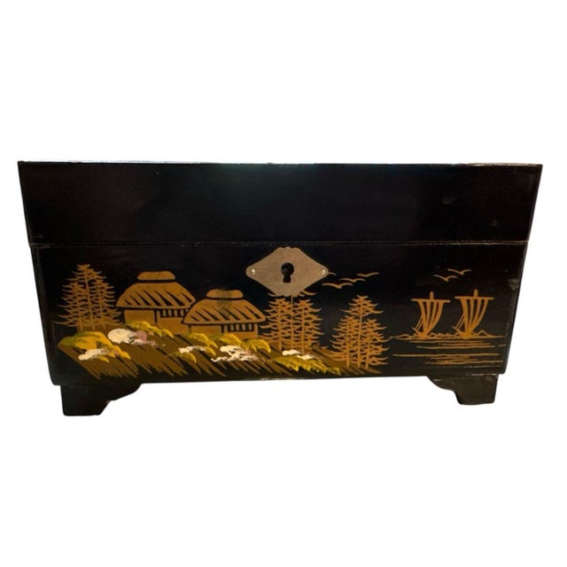 Beautiful lacquered Japanese jewelry box. The pine trees, thatched roof huts, junks with birds overhead, and reed/rice-...