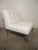 Sleek and sturdy side chairs with polished chrome base, newly recovered in a tufted white Naugahyde. Simple and handsome...