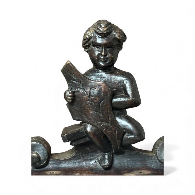 Italian sculpture, hand-carved in oak, circa 1780, of decorative or architectural character, depicting a child (a putto or...