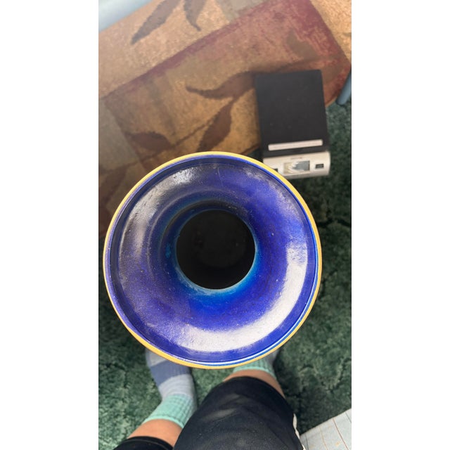 Striking antique Chinese cloisonné enamel vase dating to approximately 1900. Standing an impressive 24 inches tall, this...