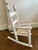 Adorable children's hand painted rocking chair. Rushed seat with fringe detail. Birdhouse painted topper atop a clover...