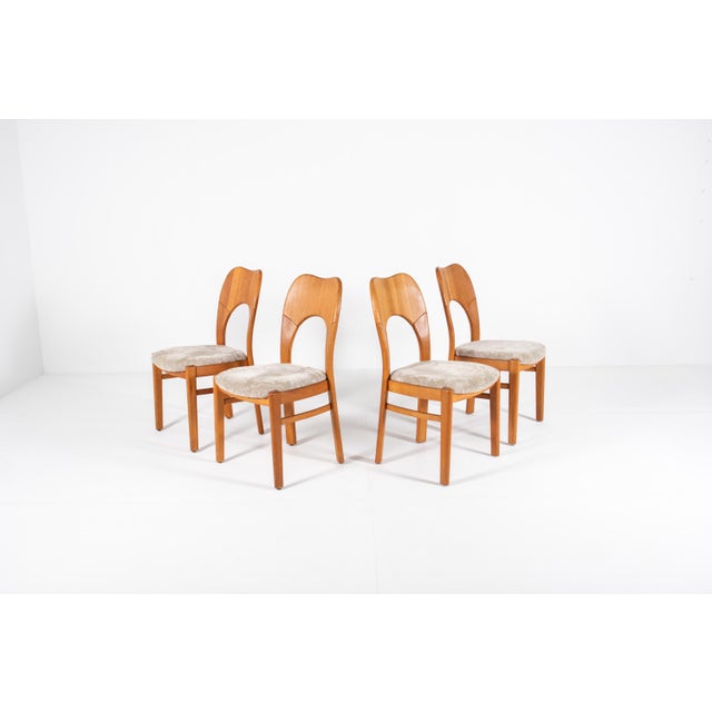 A beautiful set of four classic Danish dining chairs — the "Morten" model, attributed to Niels Koefoed. Crafted from solid...
