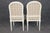 This impressive suite of painted and decorated dining chairs is conceived in the refined French Louis XVI taste,...