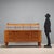 Buffet with raised top, with swing doors, in oak veneer, decorative carved panels. This piece is attributed to the...