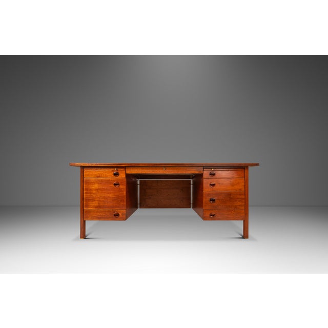 This commanding teak executive desk by Edward Wormley for Dunbar is a quintessential example of sophisticated 1950s...