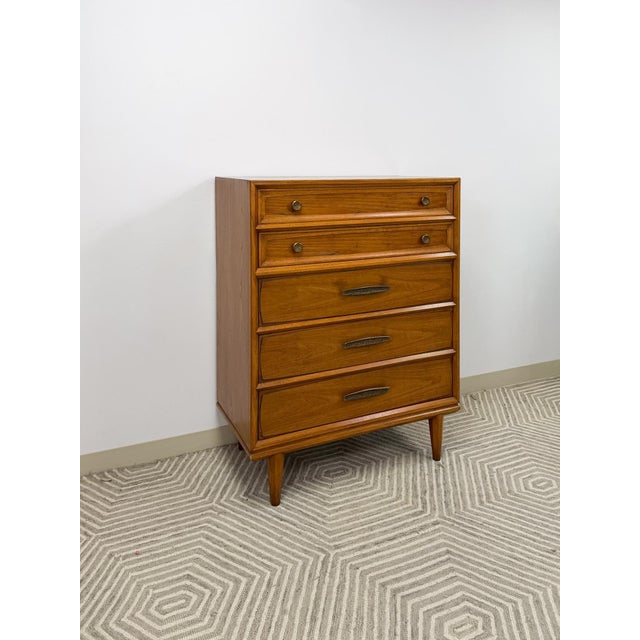 This striking vintage Heritage mid-century modern tallboy dresser is a well-made and characterful bedroom find. The...