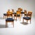 Set of eight Biedermeier chairs made of cherry wood with burl inlays on the slightly curved backrests. The seats are...
