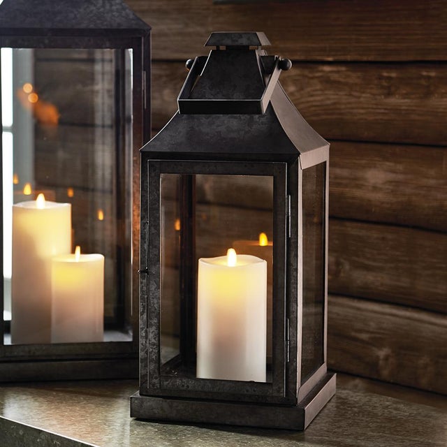 In a raw, unfinished metal, this outdoor lantern adds an industrial touch to any space. Add a selection of our LightLi...