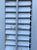 Shabby Chic Pair of Vintage White Wood Interior Bifold Louver Window Shutters For Sale - Image 3 of 4