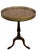 A handsome pair of traditional Chippendale-style side tables featuring elegant tripod bases, turned pedestal supports, and...