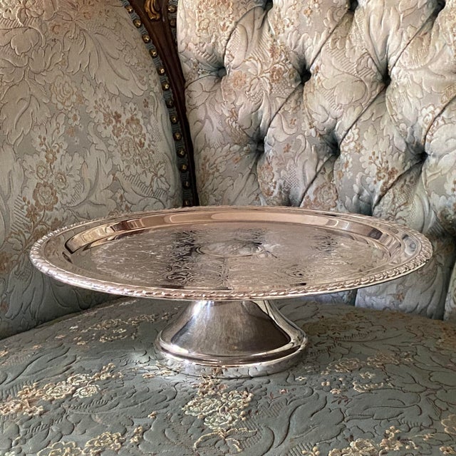 This commemorative silver plated pedestal tray is made by the Rogers Oneida Ltd. Silversmiths. It was given to a VIP who...