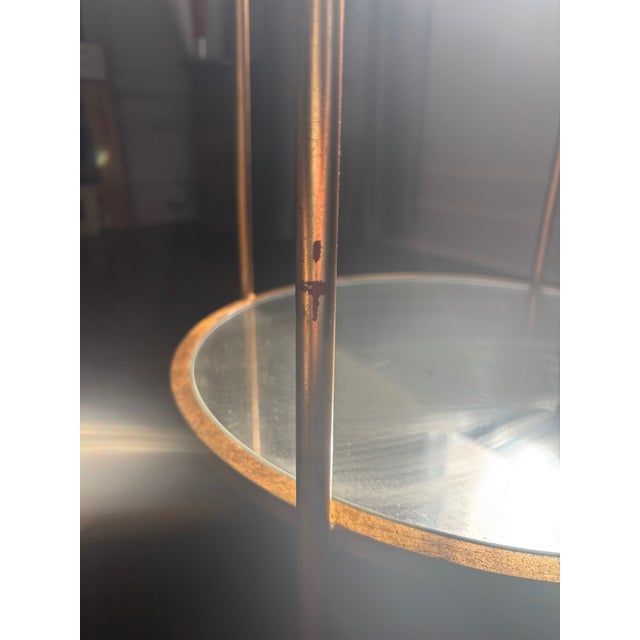 Gold leaf and mirror side tables from Worlds Away. Top and bottom level are mirrored.