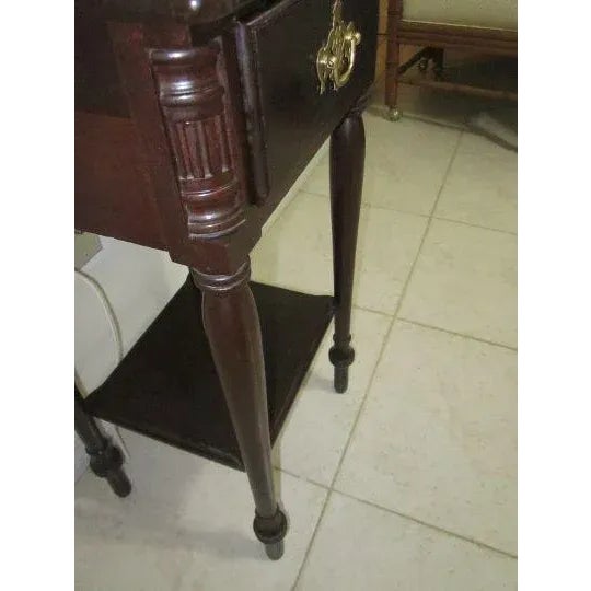 This antique accent table is a beautiful piece of furniture that will add a touch of history to any room. Featuring one...