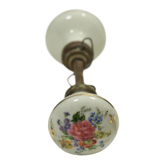 Good quality white porcelain knobs with colorful hand painted floral details. Priced as a pair of knobs with the spindle....