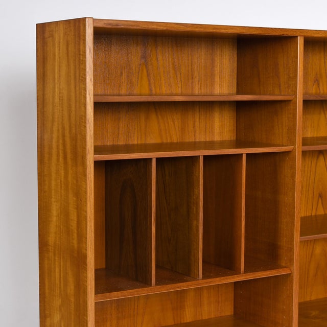 A striking teak bookcase by Poul Hundevad, produced in Denmark during the 1960s. This piece began life as the hutch top of...